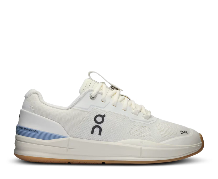 White athletic shoe with blue accent on a white background