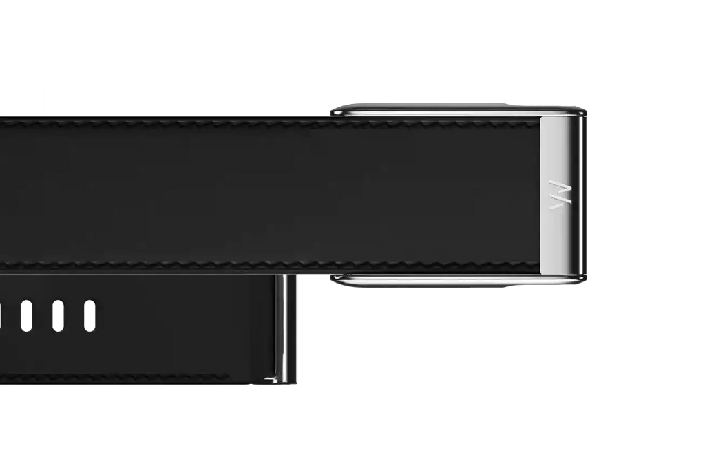Close-up of a black electronic device with metallic accents on a white background