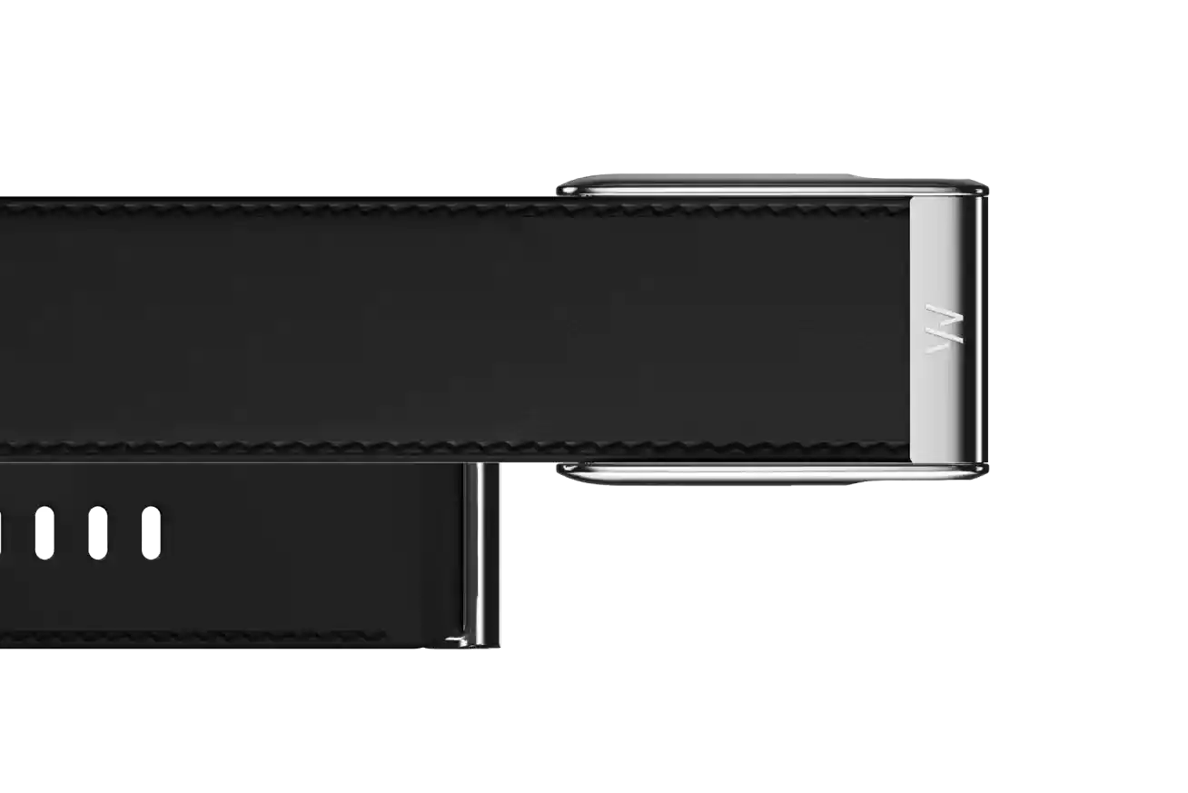 Close-up of a black electronic device with metallic accents on a white background