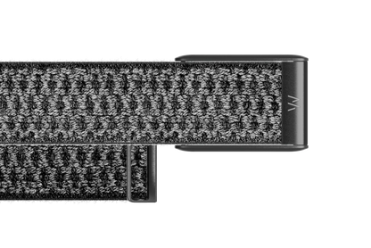 Close-up of a textured black belt with a metal buckle on a white background