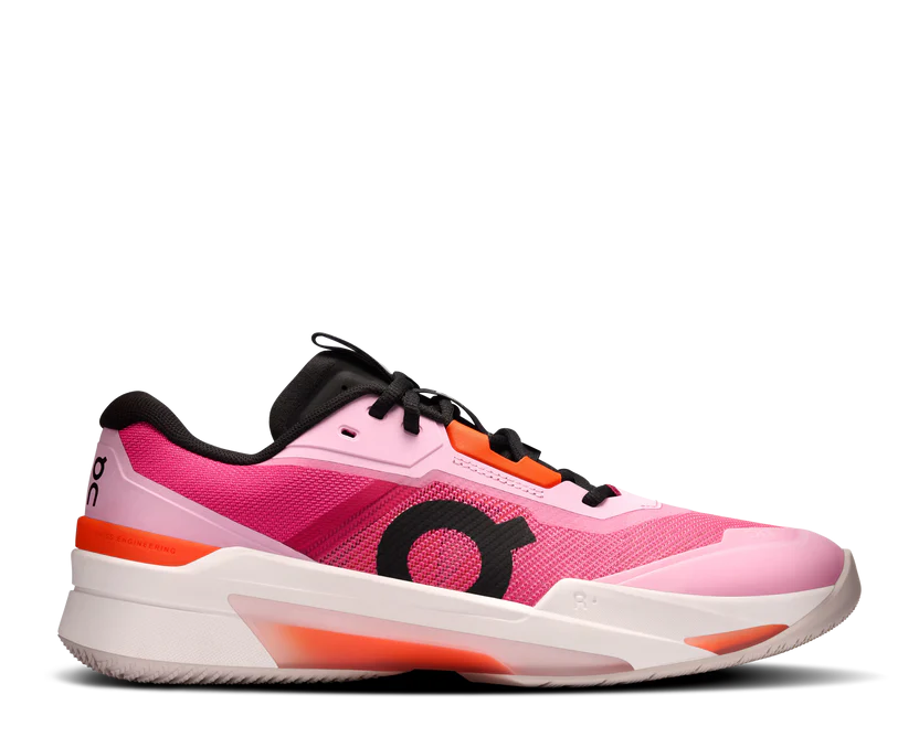 Pink and black sneaker with orange accents on a white background