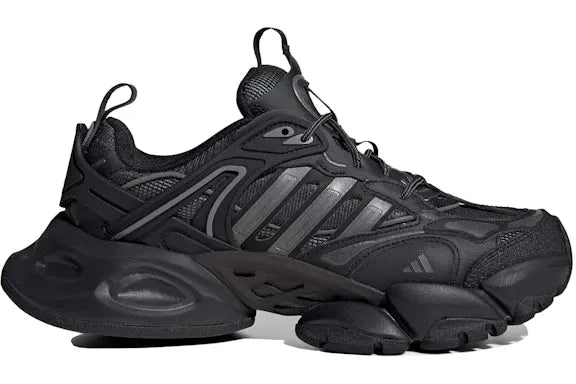 Black Adidas sneakers with a white background