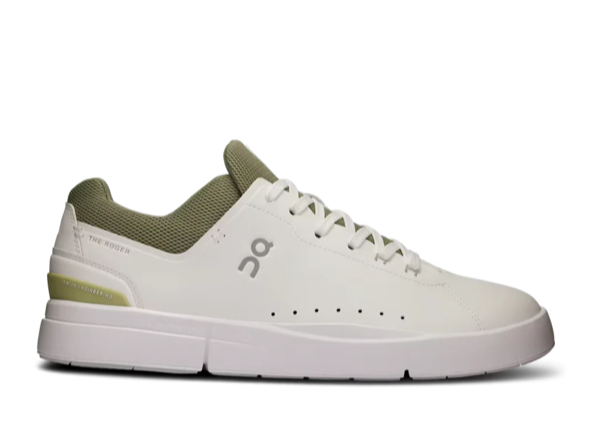 White sneaker with green accents on a white background