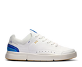 White sneaker with blue accents on a white background